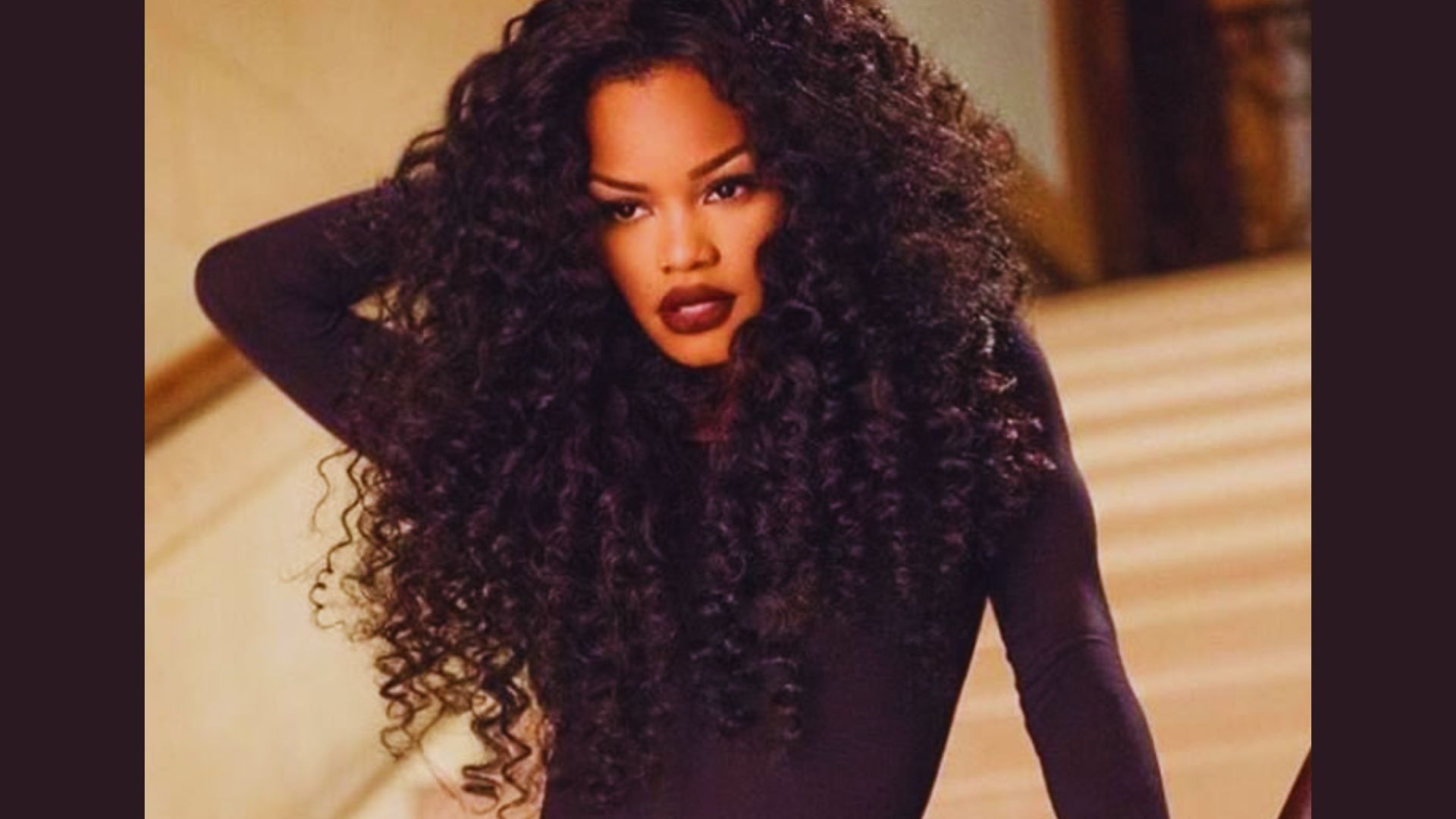 image of Teyana Taylor in curly hairstyle.