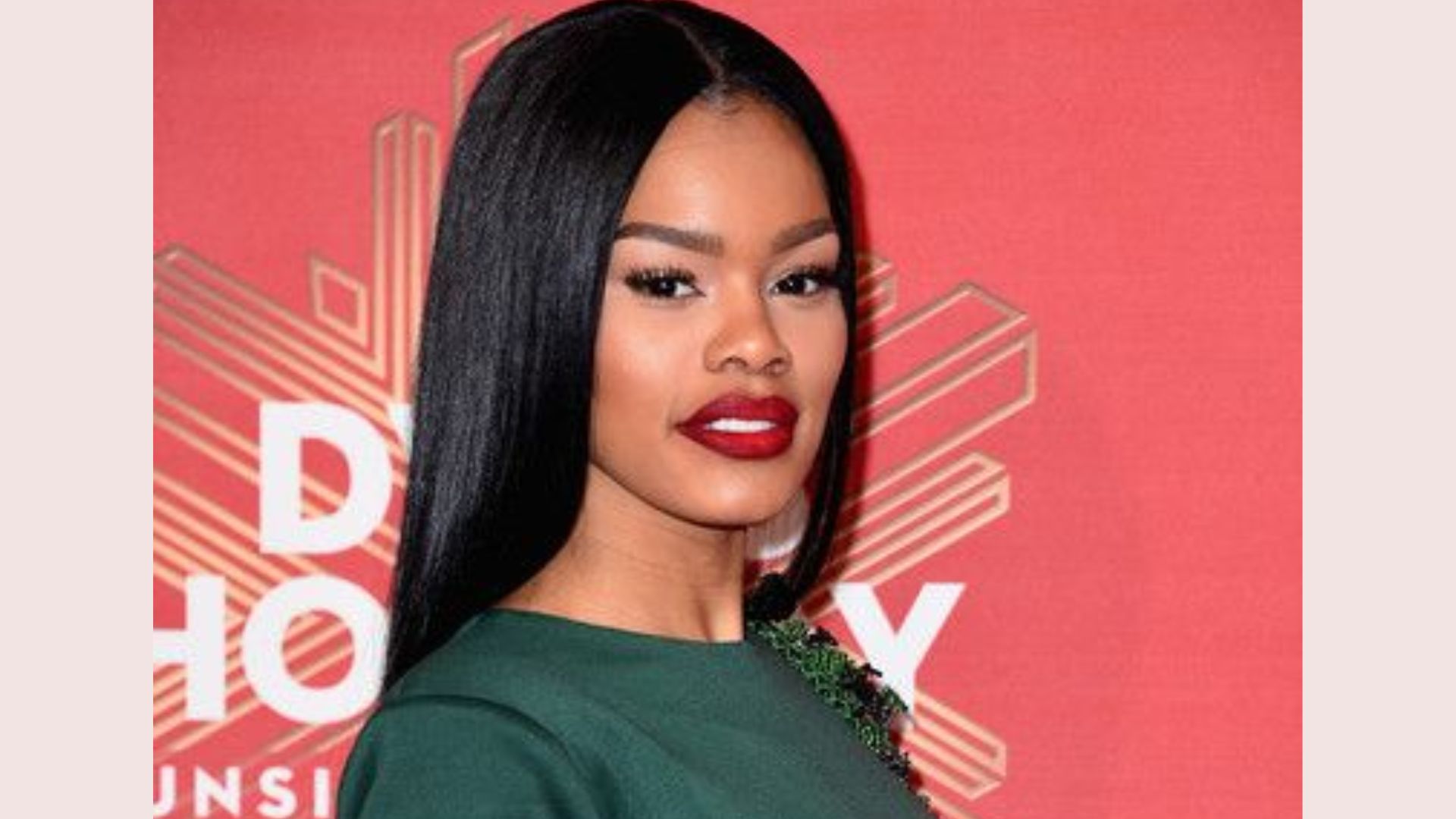 Teyana Taylor in a long straight hairstyle.