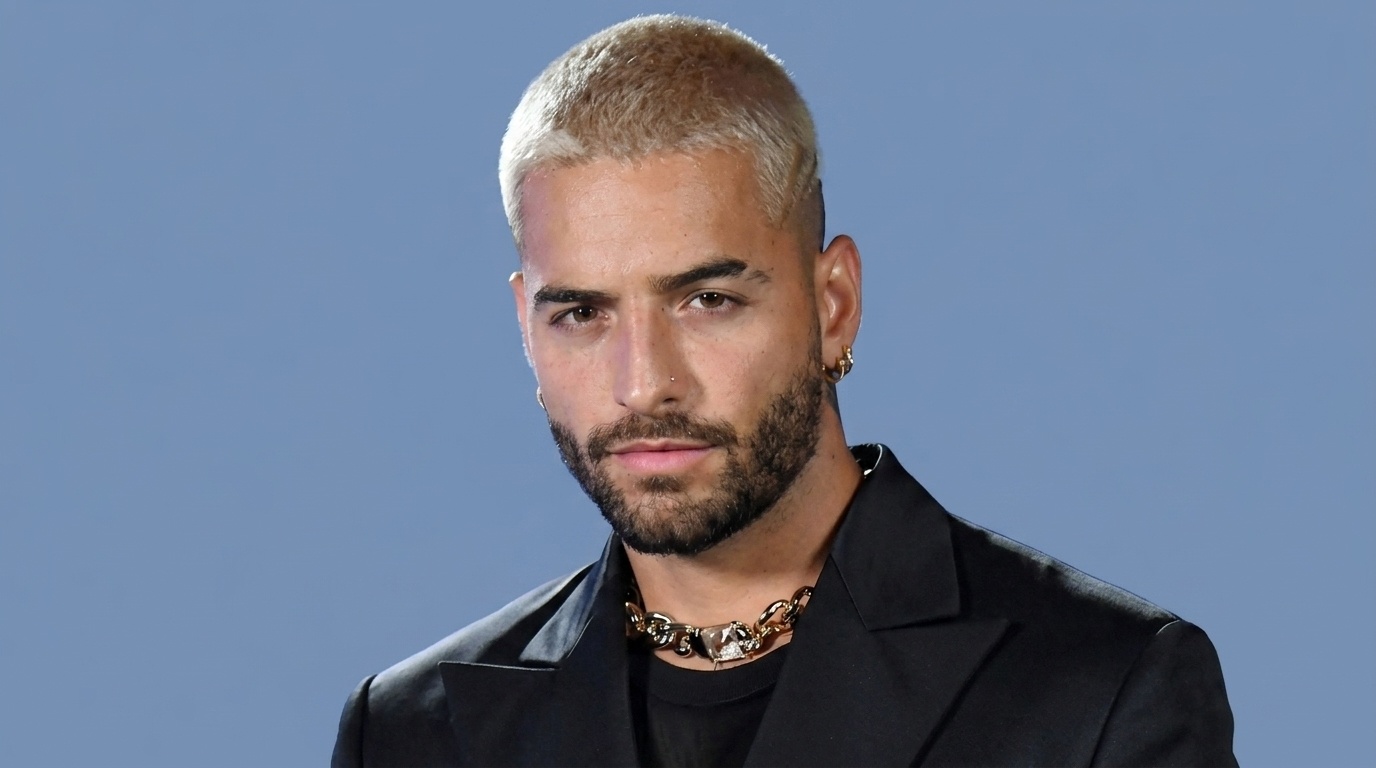 Maluma with bleached crop cut and short faded sides on blue background