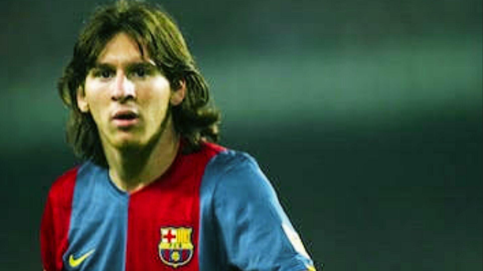 Young Lionel Messi with long shaggy haircut in early Barcelona career