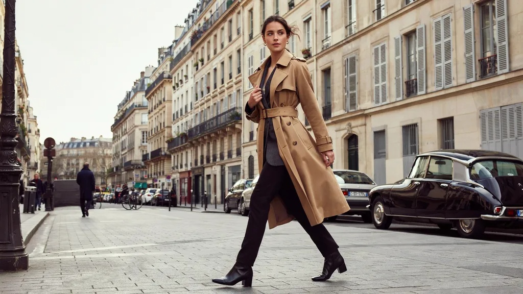 Woman wearing structured outerwear that flatters broad shoulders.