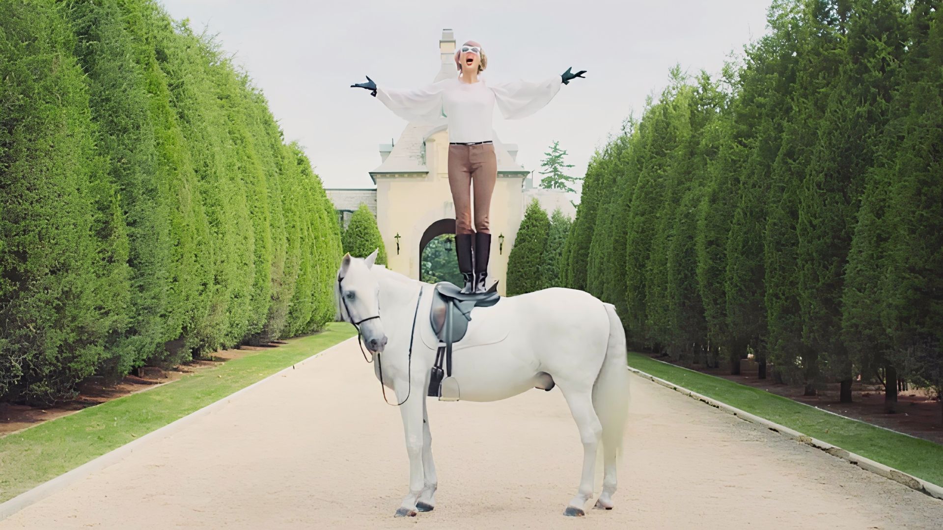 Equestrian-inspired fashion look with riding boots and tailored jacket.