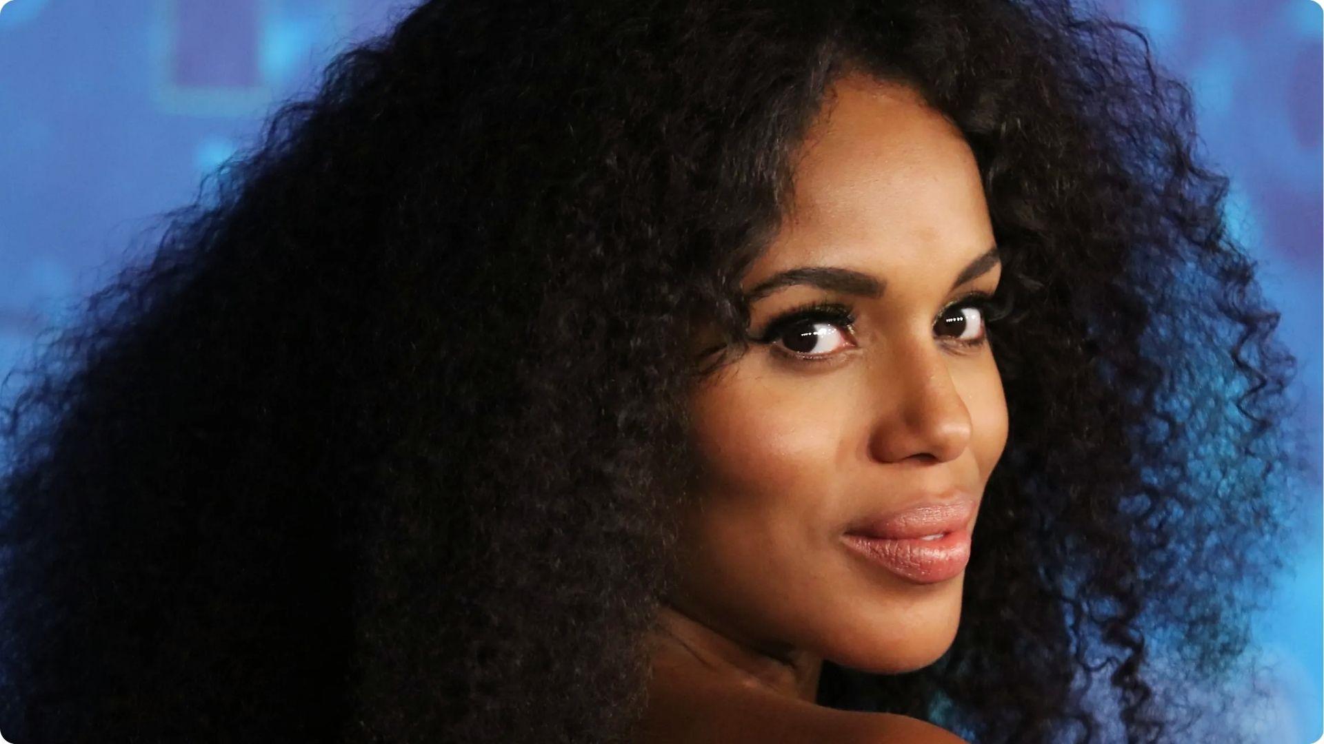 Kerry Washington turning back with extra long voluminous natural curly hair and glowing skin makeup