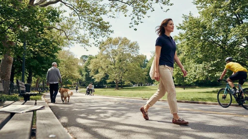 Polo shirt paired with chino pants in timeless preppy style.