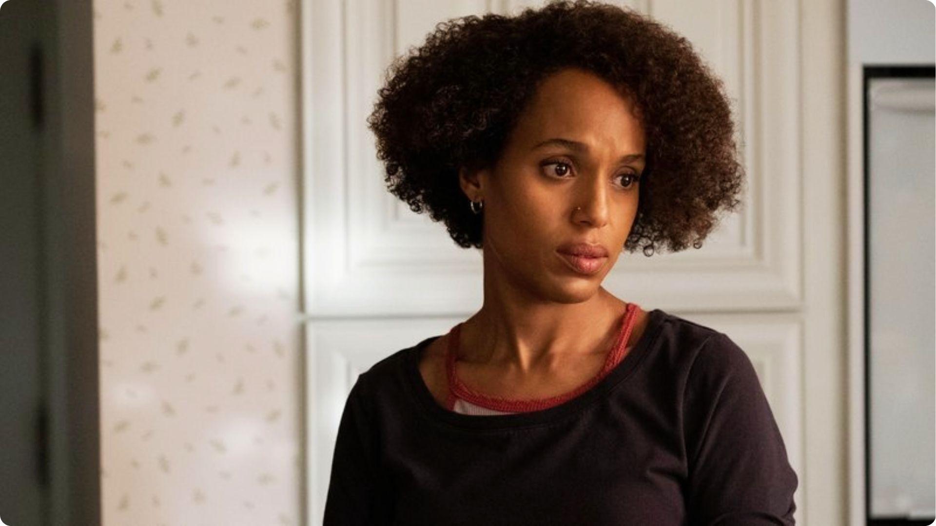 Kerry Washington with short natural curly afro hairstyle wearing black top in indoor in casual behind the scene
