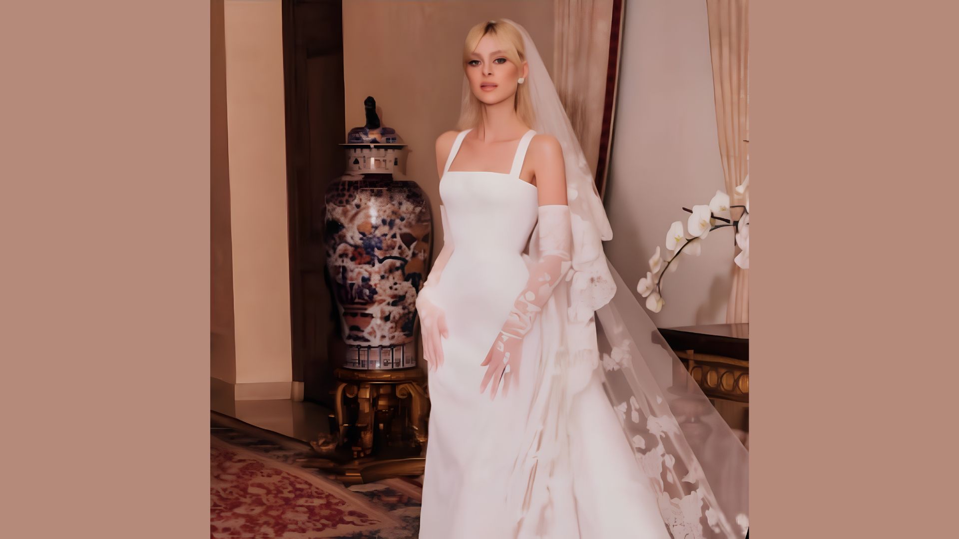 Nicola Peltz custom wedding dress in an atelier.