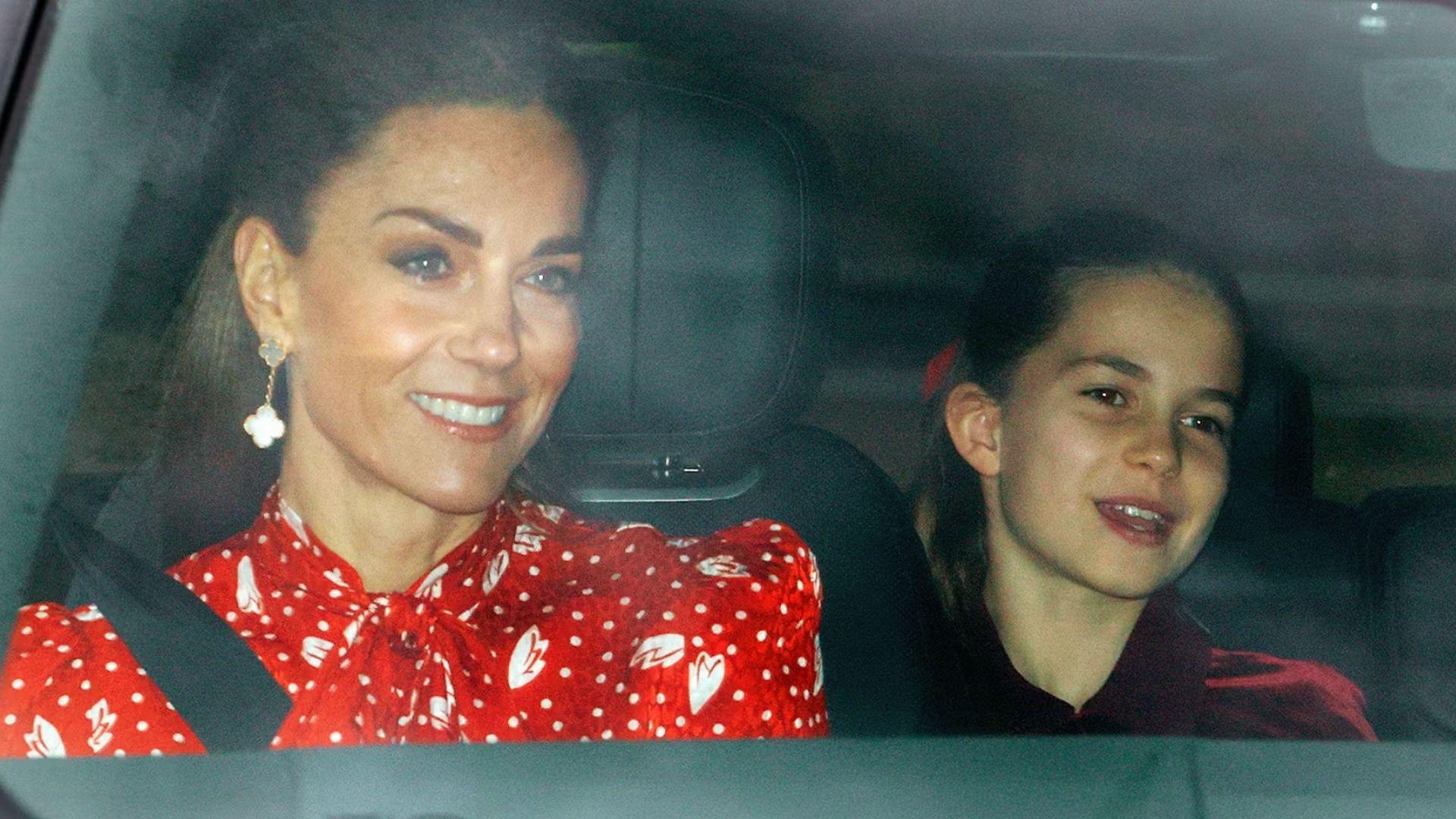 Kate Middleton wearing Van Cleef Alhambra earrings with red polka dot blouse in car with Princess Charlotte