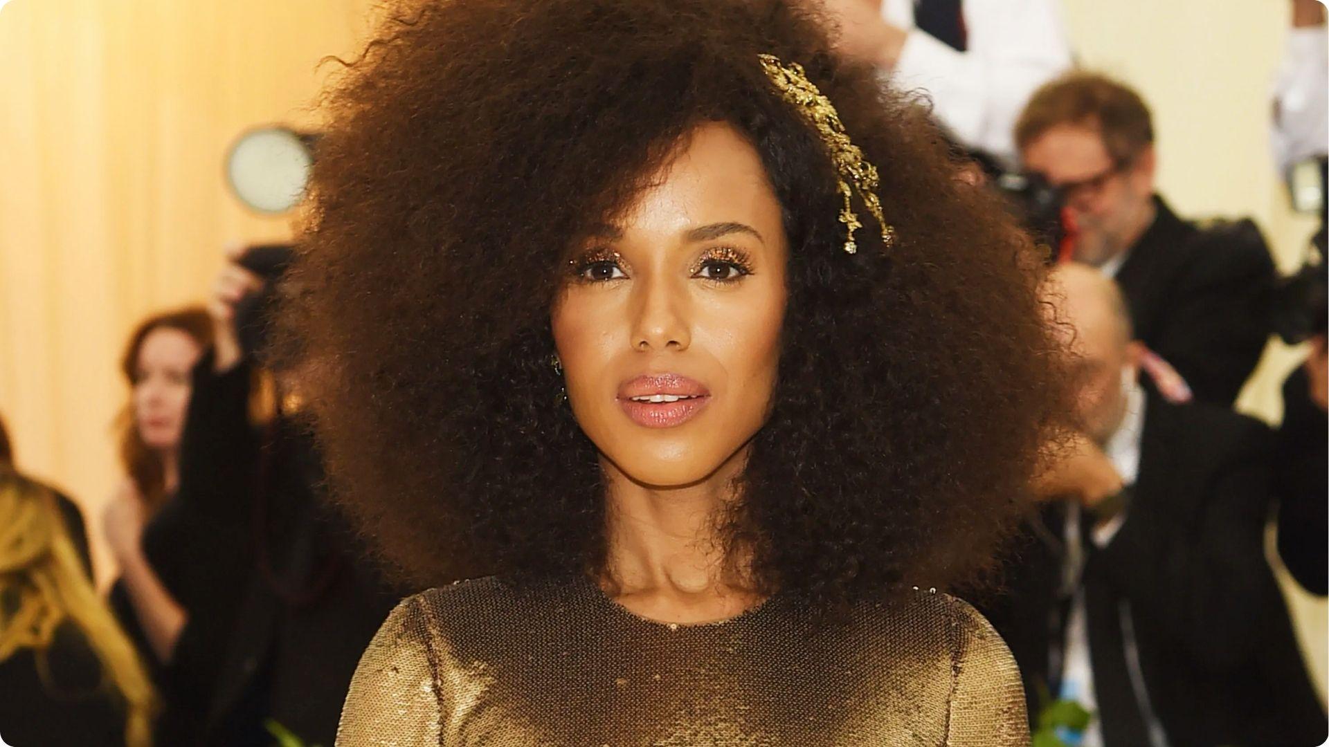 Kerry Washington at Met Gala with huge natural afro and gold leaf headpiece in sequin dress