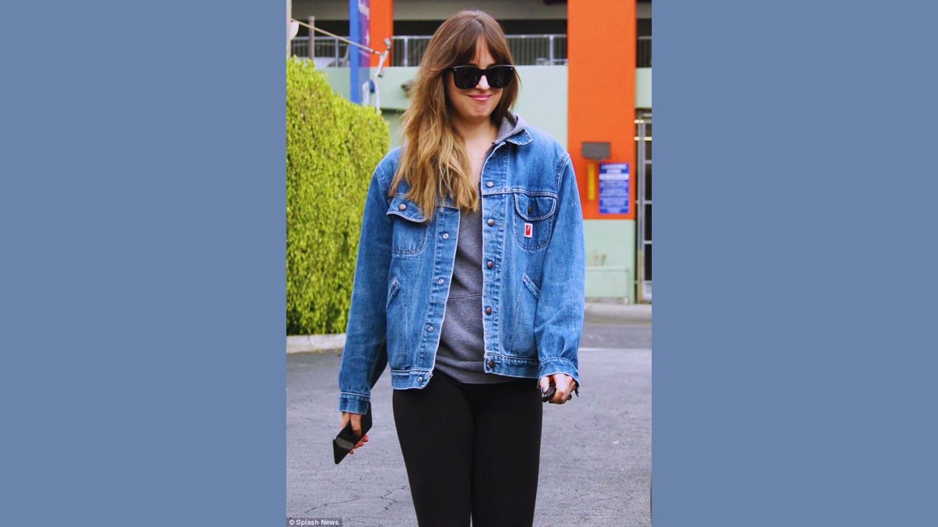 Woman styling mixed-wash denim pieces in a casual outfit.