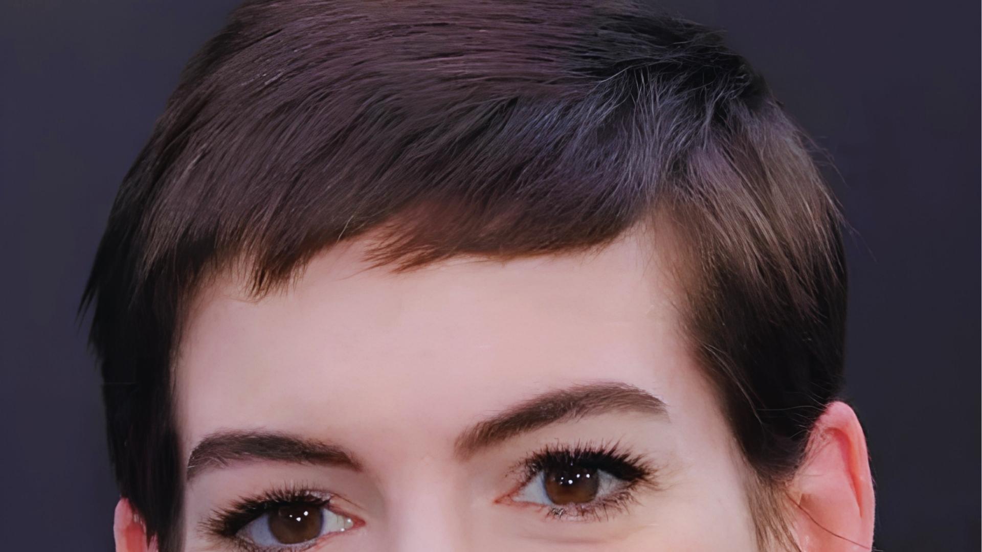 Sleek brunette pixie with short choppy bangs and close-cropped sides, capturing Twiggy’s minimalist 1960s androgynous vibe.